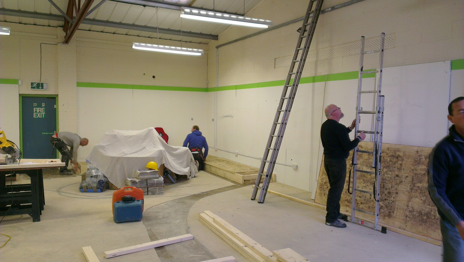 Stud walls and framing going up inside the empty unit
