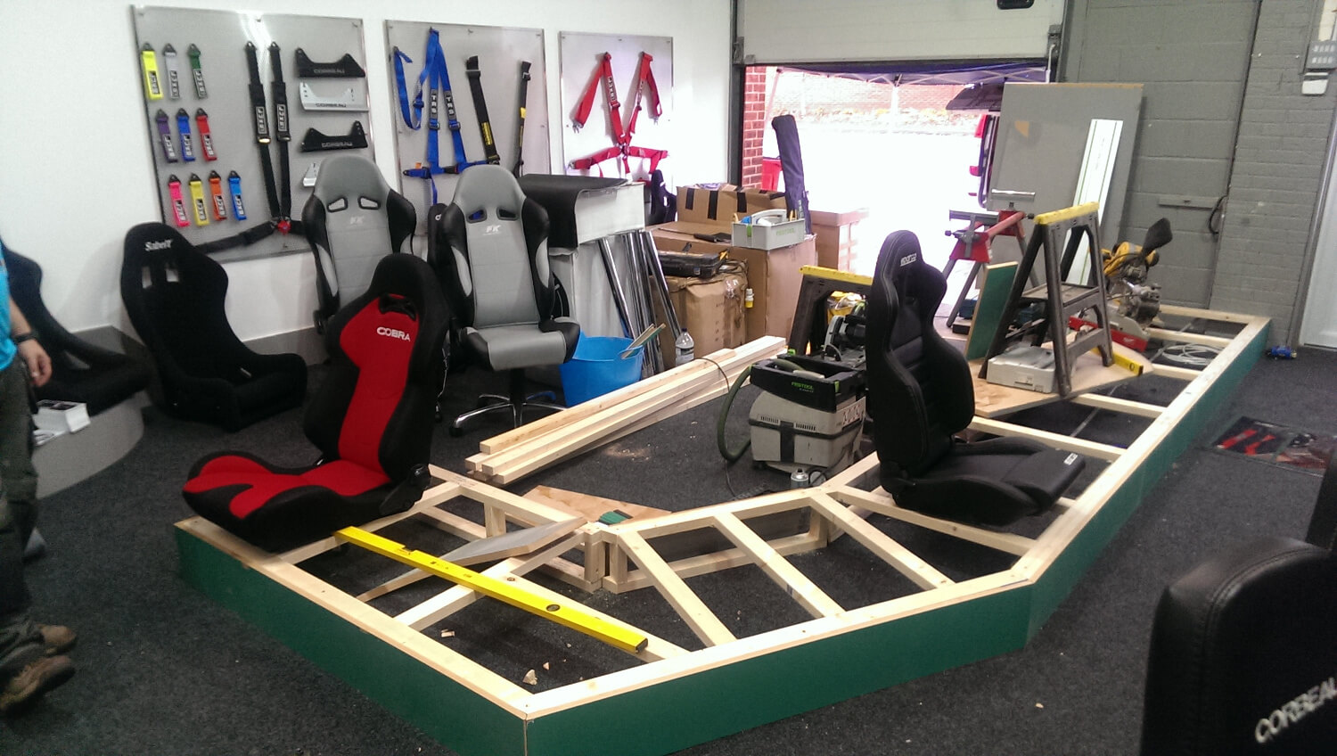 Additional racing seat display racking being built