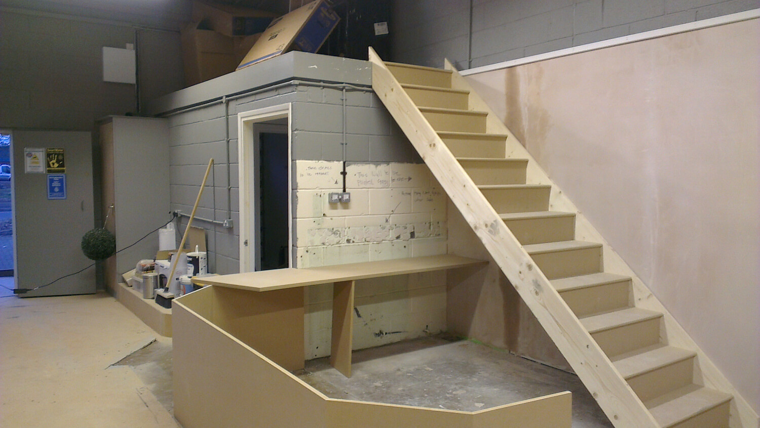 Reception desk under construction in the new showroom
