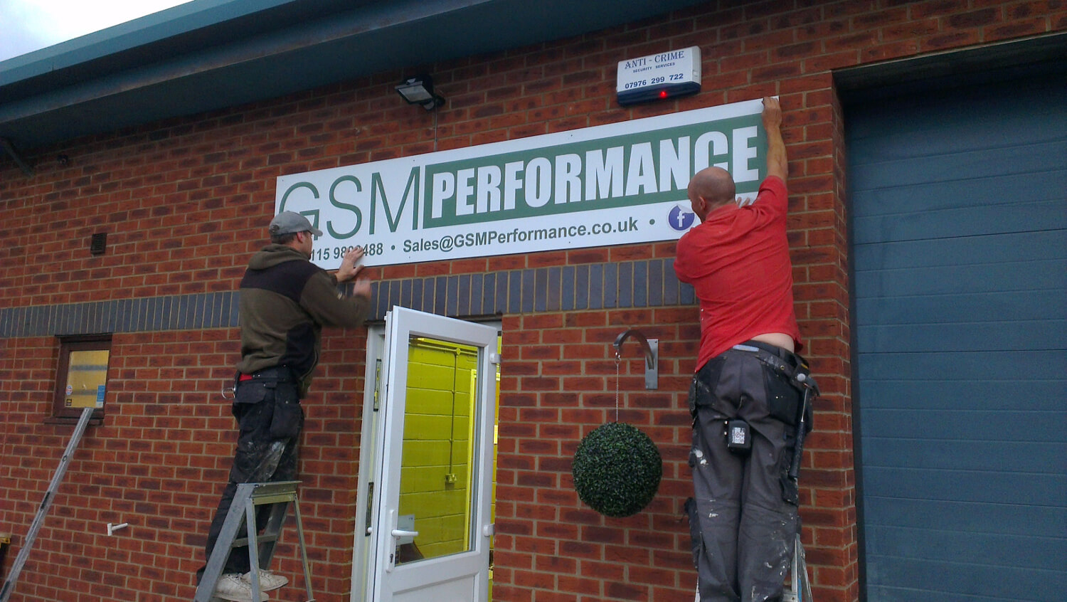 GSM Performance sign being fitted to the outside of the unit