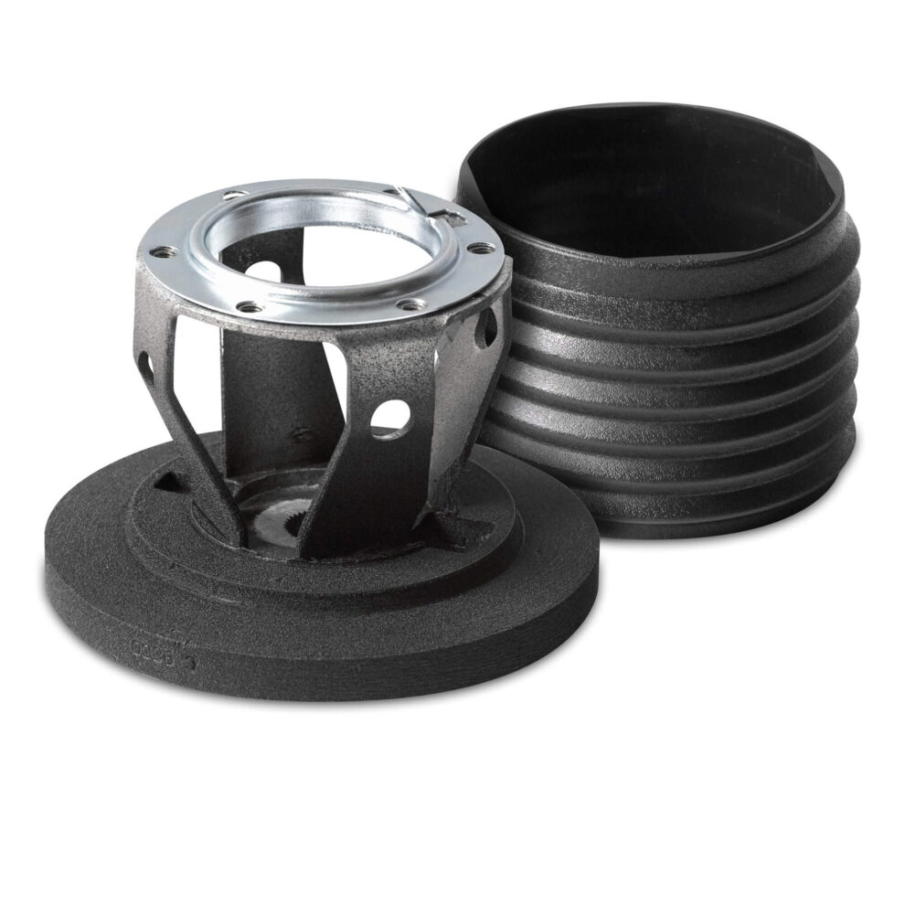 A MOMO steering wheel hub and its ribbed cover on a white background