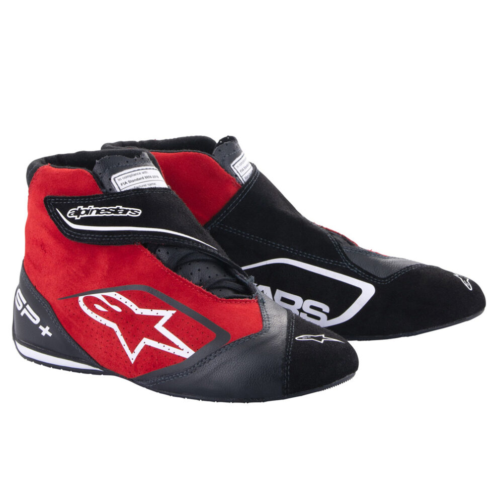 A pair of red and black Alpinestars SP+ race boots with white Alpinestars logos, on a white background