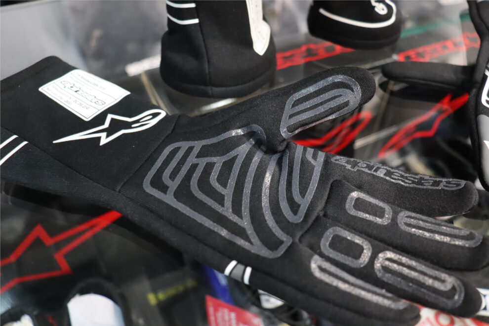 The palm of a black Alpinestars Start V3 race glove showing the grey silicone grip print