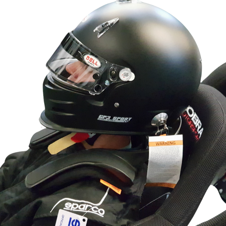 Bell GP3 Sport helmet with a silver FHR post on the shell, tethered to a HANS device on the driver's shoulders in a Cobra seat