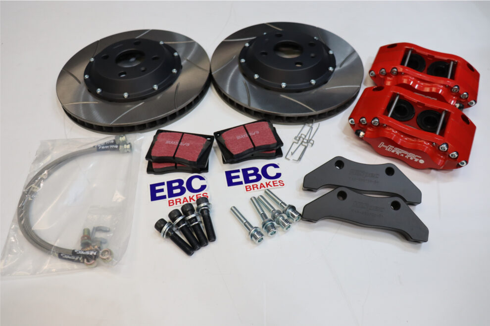 The Hi Spec Nova kit laid out: two grooved discs on black bells, two red Billet 4 calipers, black brackets, EBC pads, bolts and braided hoses