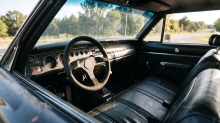 late 1960s American muscle car fitted with an aftermarket motorsport steering wheel