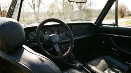 1970s Fiat 124 Sport Spider fitted with an aftermarket motorsport steering wheel