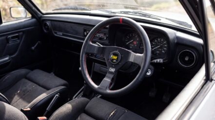 Right hand drive Ford Escort Mk2 cabin with a three spoke OMP steering wheel fitted to a boss kit