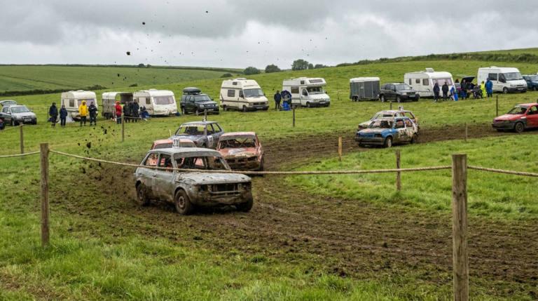 Autograss cars sliding around a grass oval