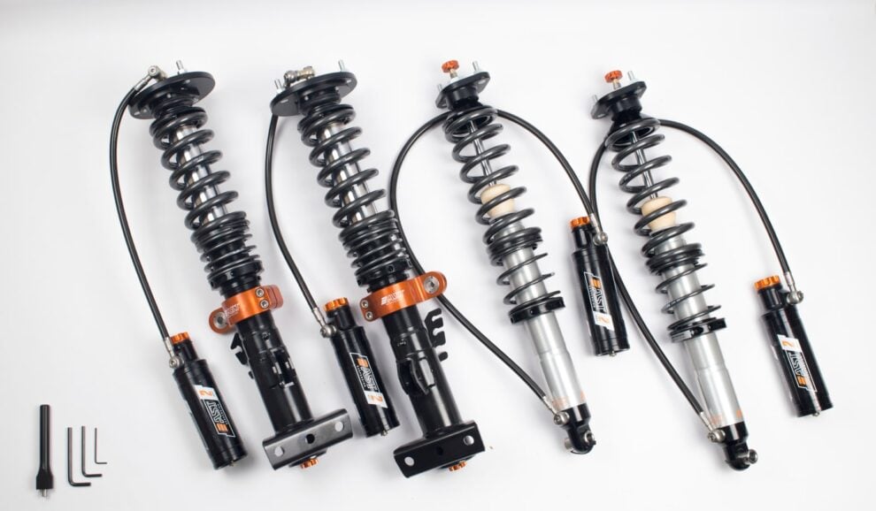 AST 5200 2-way coilover kit with black remote reservoirs on braided hoses