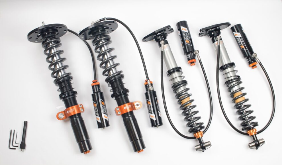 AST 5300 3-way coilover kit with remote reservoirs and orange adjuster knobs