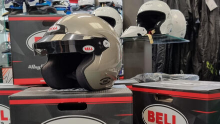 A Bell Mag open face helmet sitting on Bell helmet boxes in the GSM Performance showroom