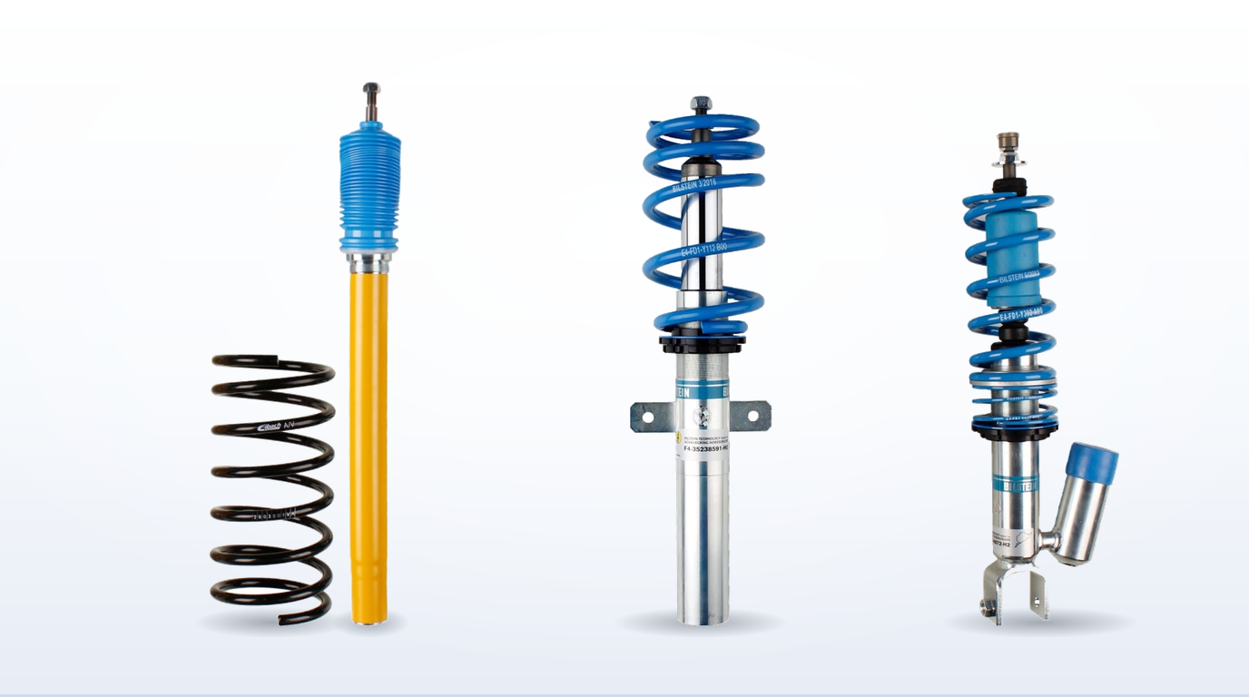 A Bilstein B12 front strut and Eibach spring, a B14 threaded body coilover and a B16 PSS9 coilover with its remote reservoir, stood side by side