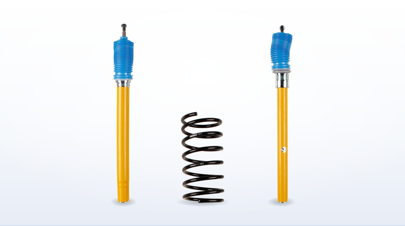 The 51 mm and 45 mm Bilstein B12 front struts for the BMW E30 stood either side of an Eibach Pro-Kit spring, showing the difference in body diameter