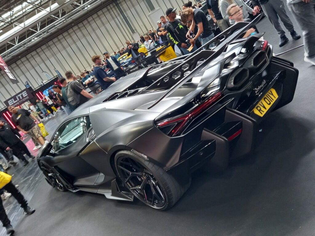 Matte grey Lamborghini Revuelto from the rear with its hexagonal exhaust vents and huge diffuser, Gravity Show 2026