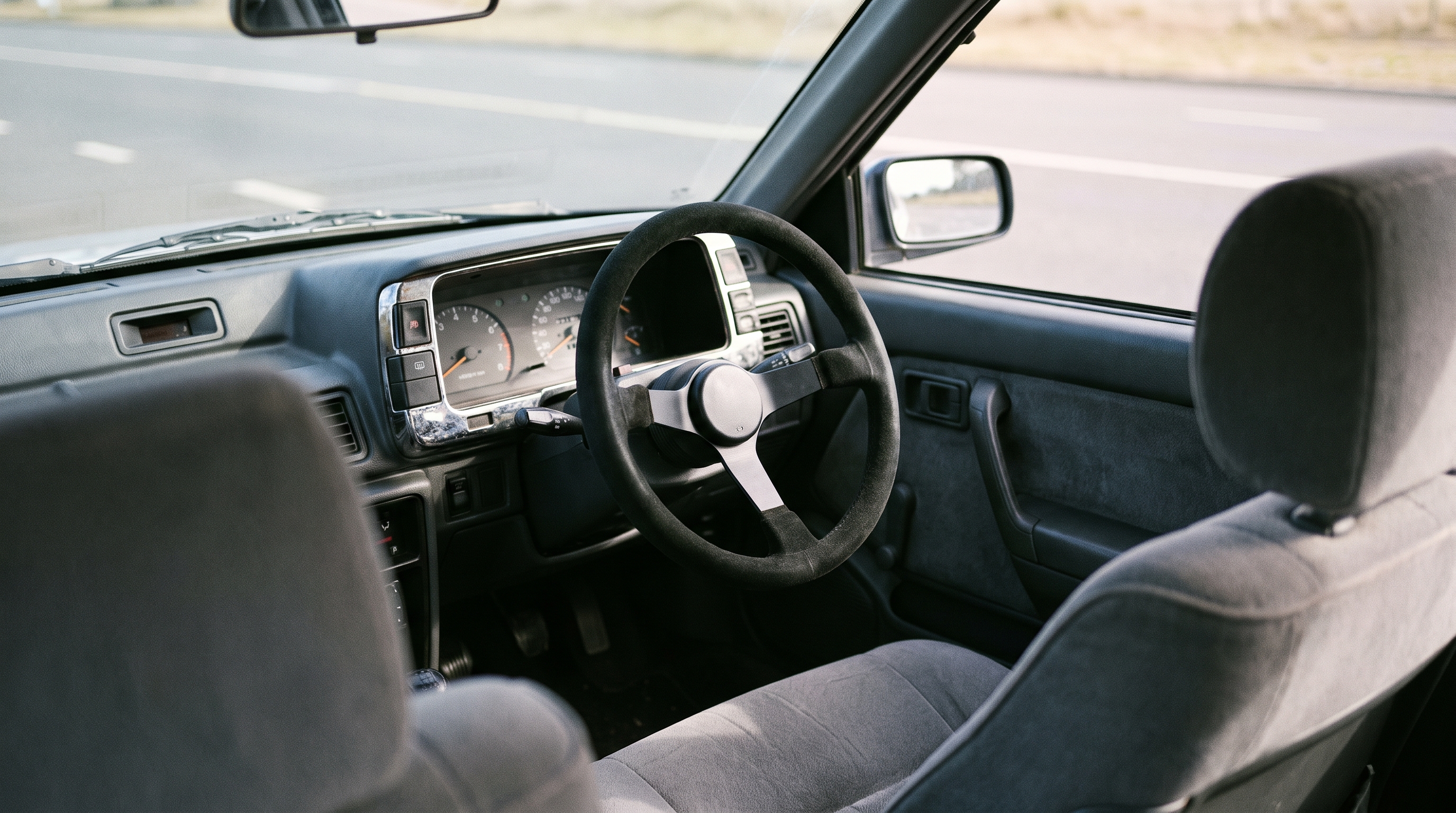 late 1980s Hyundai Sonata saloon fitted with an aftermarket motorsport steering wheel