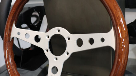 MOMO Indy Heritage steering wheel with mahogany rim and silver spokes on the GSM Performance showroom display