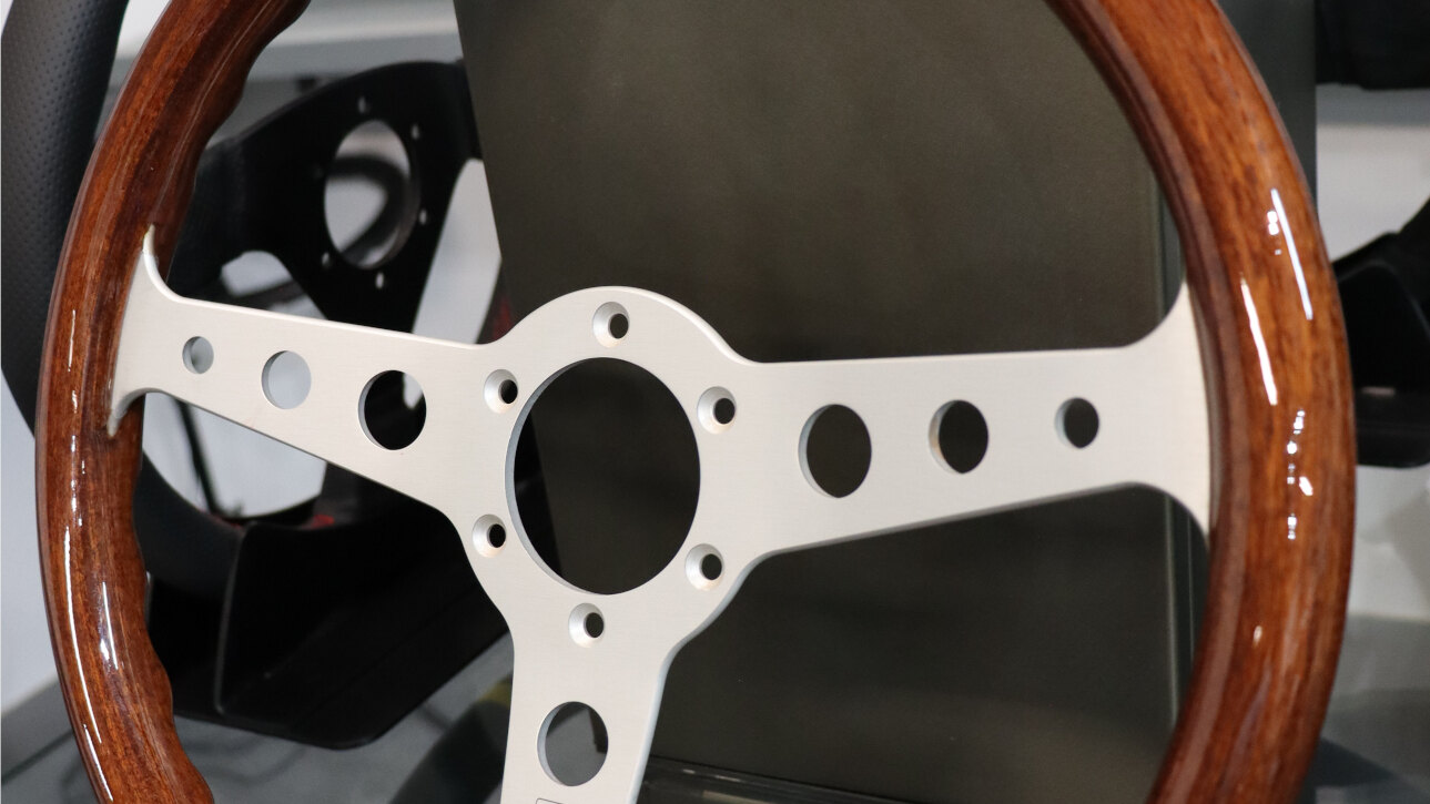 MOMO Indy Heritage steering wheel with mahogany rim and silver spokes on the GSM Performance showroom display