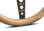 Close up of the lower spoke of the MOMO Prototipo Desert showing the etched prototipo box and the yellow MOMO logo on the dark brown anodised finish