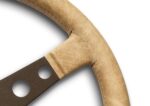 Close up of the MOMO Prototipo Desert where the dark brown anodised spoke meets the Sahara vintage leather rim, showing the drilled lightening holes