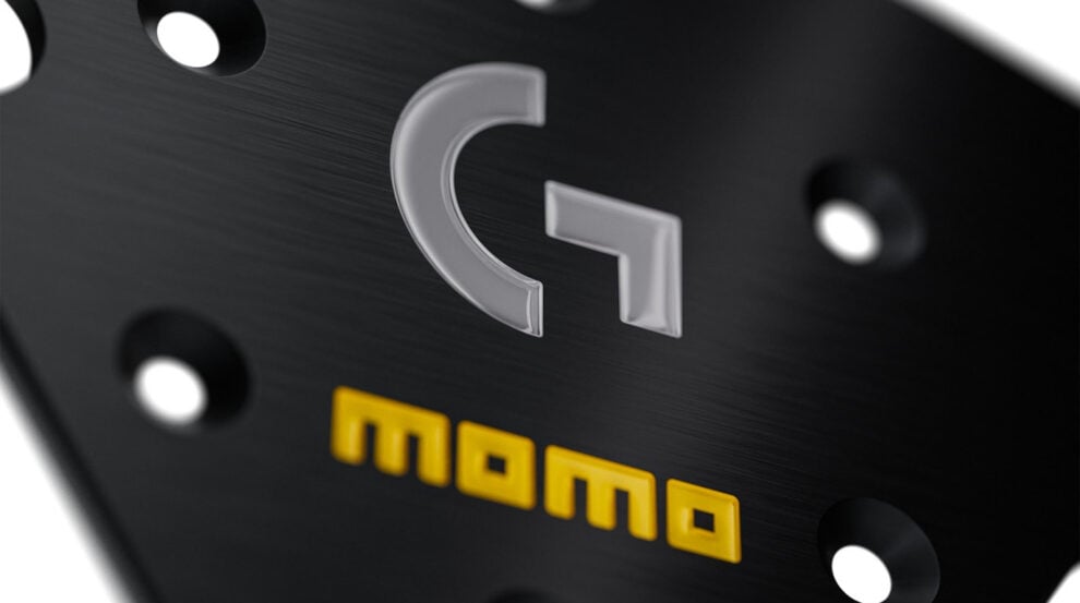 MOMO Sim GT 320 x Logitech G steering wheel, black microfibre rim and black anodised spokes, photographed at an angle