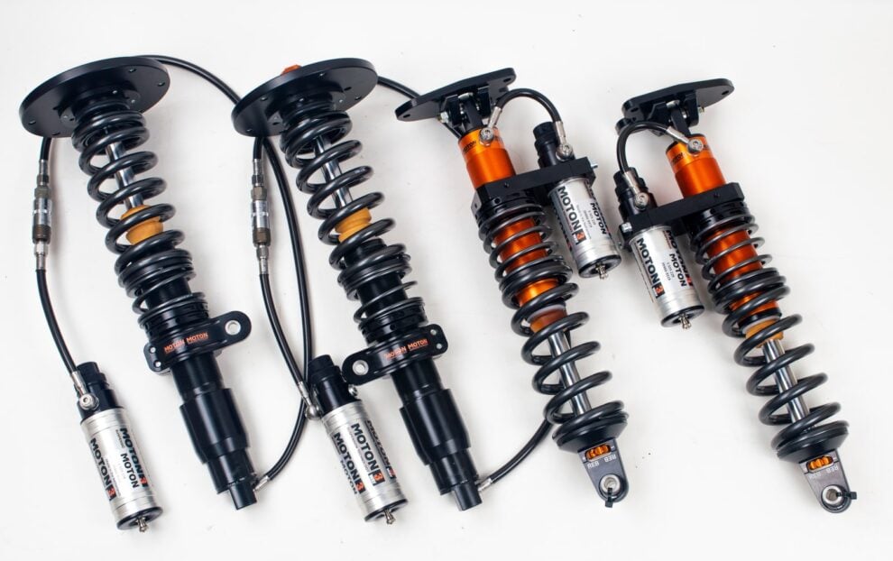 MOTON 3-way coilover kit with silver remote reservoirs on braided hoses