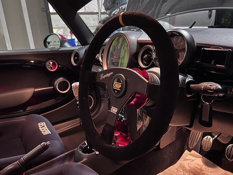 An OMP Velocita Superleggero suede steering wheel fitted in a customer's car, seen from the driver's door