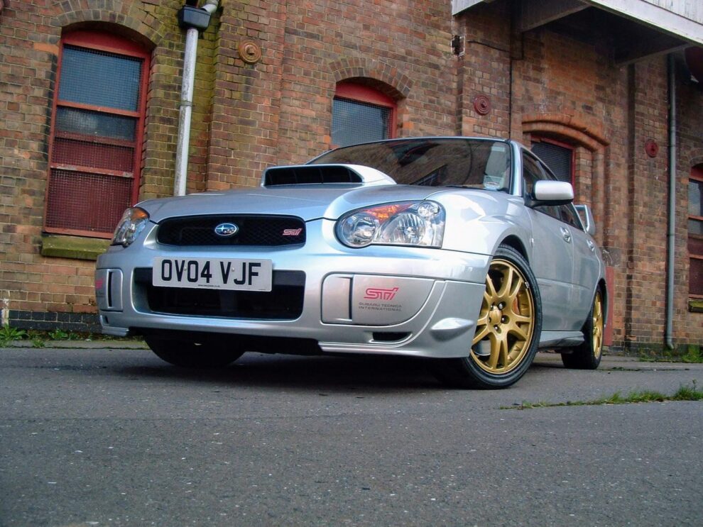 Garreth's old silver 2004 Subaru Impreza WRX STI, registration OV04 VJF, on gold wheels