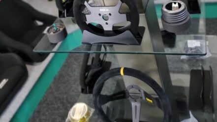 Steering wheels, a boss kit and a quick release on the glass display stand in the GSM Performance showroom