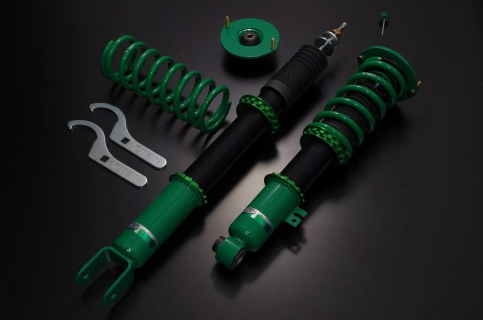 TEIN FLEX Z coilover kit with green springs and bodies, black dust boots, upper mount and spanners