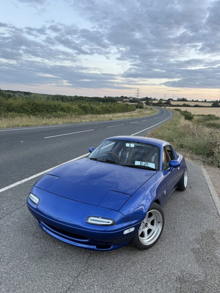 From Drift Car To Daytona Blue: A Mk1 MX-5 Rebuilt On Mirco Houndstooth Buckets